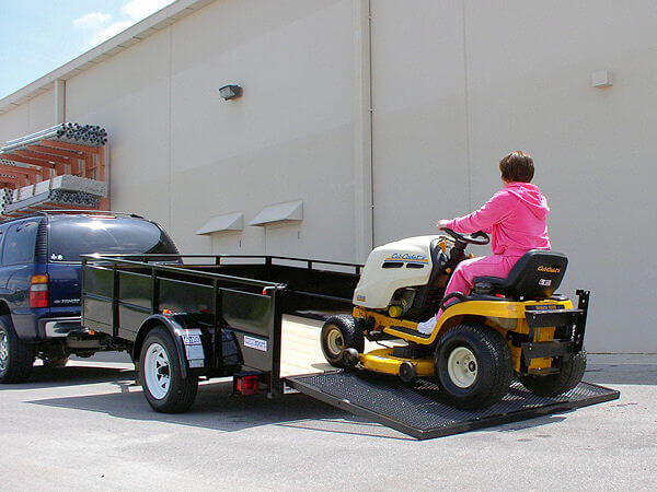 Step 3 of loading a riding lawnmower with Tilt-A-Hitch!